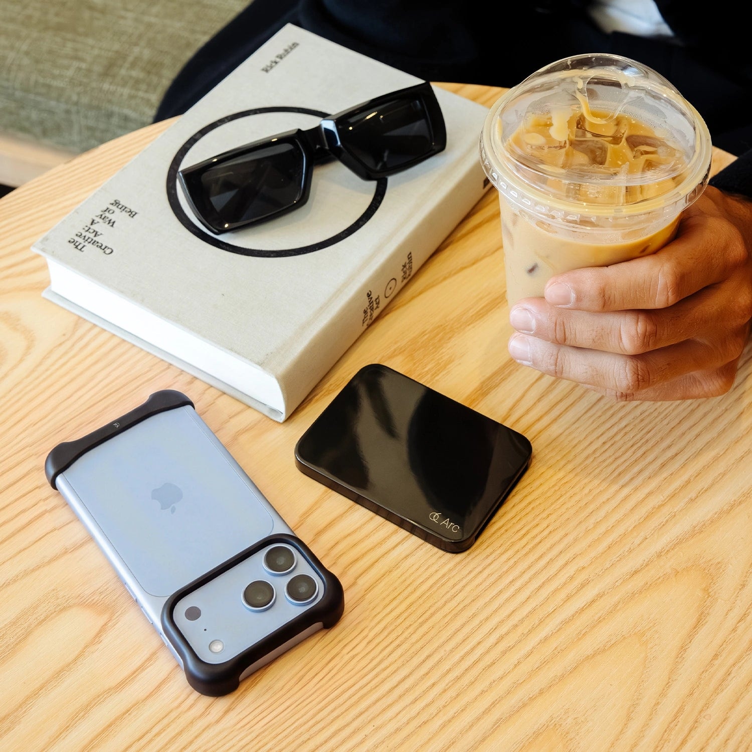 Arc Pulse for iPhone 18 Pro on a cafe table