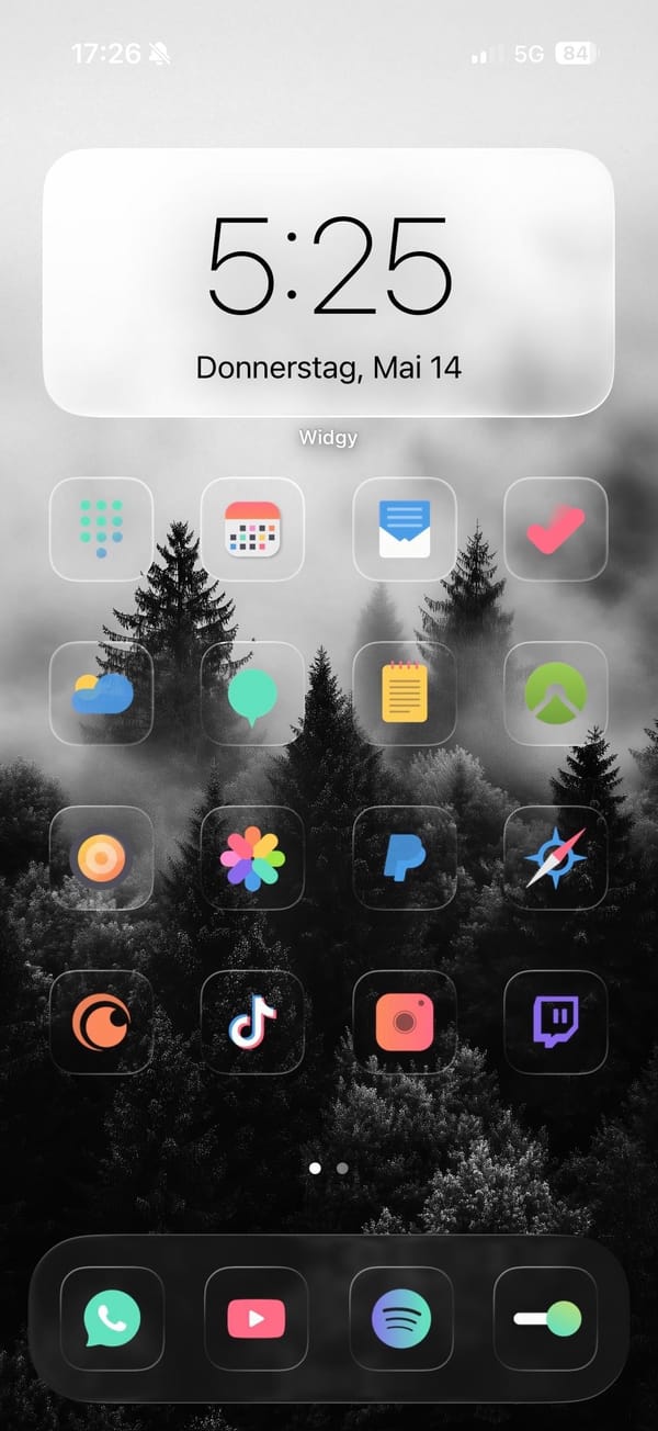 Colorful glass icons and a B&W foggy forest wallpaper